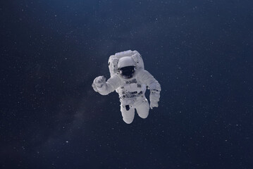 cosmonaut fly in the outer space with stars and galaxy background with a light beam. elements of this image furnished by nasa