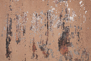 photo texture of old peeling paint on rusty damaged metal