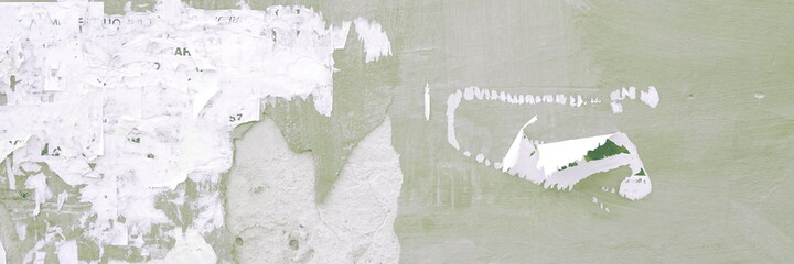 Scratched Advertising Rough Background. Exposed Weathered Urban Wall with Torn Street Posters, Paper and Stickers. Vintage Billboard With Torn Poster, Paper, Ads Wide Grunge Background Or Texture.