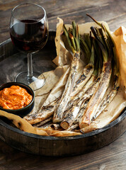 grilled Calcots onions traditional Catalan winter dish - obrazy, fototapety, plakaty