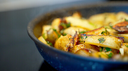 Fried village potatoes with herbs.
