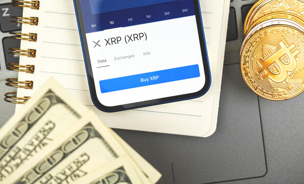 Buy and sell Ripple XRP crypto currency with your mobile phone, trade and exchange business and investment background photo