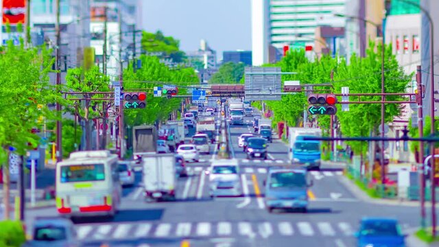 A timelapse of miniature traffic jam at the avenue tiltshift zoom