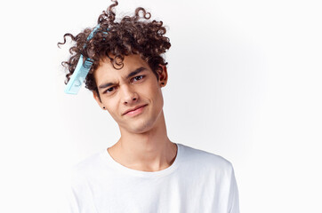 curly guy with comb in hair emotions fun cropped view