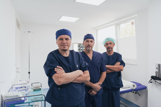 Multiethnic Orthopedic Doctor In Front Of His Medical Team Looking At Camera Wearing Face Mask 