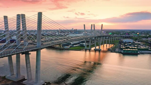 Drone footage of the new cable-stayed Goethals bridge at sunset, with forward camera motion. Goethals bridge spans Arthur Kill strait, between Elizabeth, NJ and Staten Island, NY