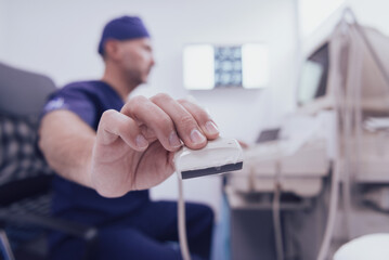  doctor working at the hospital operating ultrasound scanning machine examining knee of her female patient technology modern medicine people vitality concept.