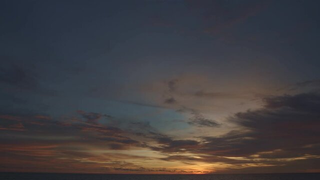 .beautiful colud at sunset above the sea  .Nature video High quality footage Scene of Colorful romantic sky sunset with cloud in the sky background .for creative nature and travel concept. ...