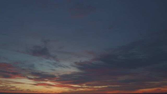 .beautiful colud at sunset above the sea  .Nature video High quality footage Scene of Colorful romantic sky sunset with cloud in the sky background .for creative nature and travel concept. ...