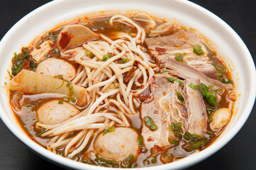 Pork belly, tofu, cabbage, and noodles with kimchi, at a Korean restaurant.