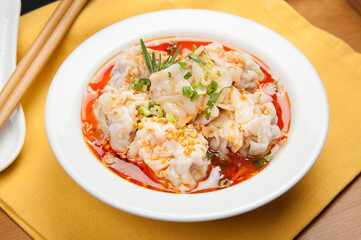 Dim sum dumplings in soup at a Korean restaurant.