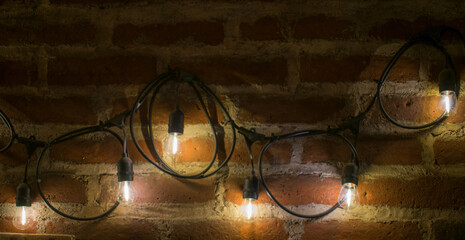 antique led spotlights lighting up an antique brick wall
