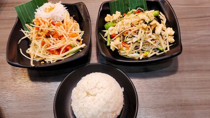 rice and papaya salad on the table.
