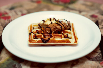 Waffle with ice cream and chocolate sauce