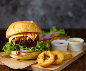 Close up shot of ready to eat homemade beef hamburger with fresh vegetables