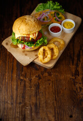 Close up shot of ready to eat homemade beef hamburger with fresh vegetables