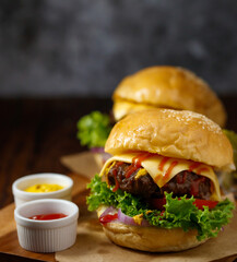 Close up shot of ready to eat homemade beef hamburger with fresh vegetables