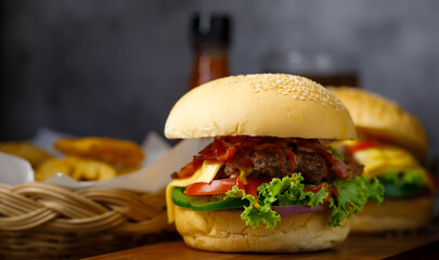Ready to eat homemade hamburger with bottle of catchup in background and copy space