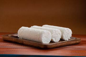 White raw rice Puttu/Pittu_wooden background