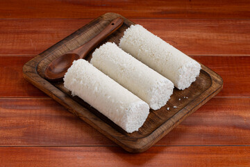 White raw rice Puttu/Pittu_wooden background