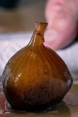 figs in syrup on white plate