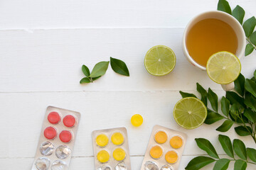 honey lemon herbal healthy drinks health care for cough sore with pastille arrangement flat lay...