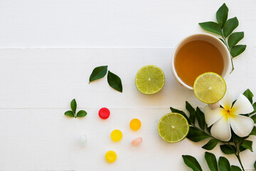honey lemon herbal healthy drinks health care for cough sore with pastille arrangement flat lay...