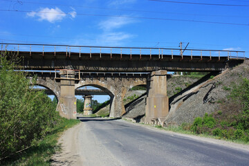 Railway viaduct over the asphalt road