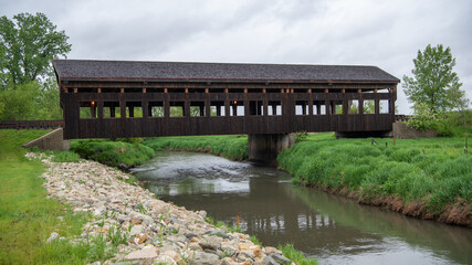 Fototapeta na wymiar Modern covered bridge over Rock Creek on Crosby Road in Morrison, Whiteside County, Illinois