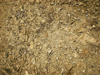 Soil background. Stony ground. Ground and stones. Crushed stones