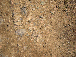 Soil background. Stony ground. Ground and stones. Crushed stones. Natural background