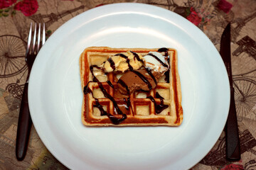 Waffle with ice cream and chocolate sauce