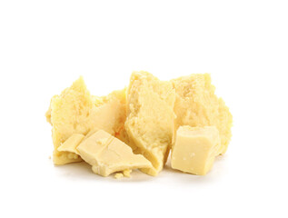 Pieces of cocoa butter on white background