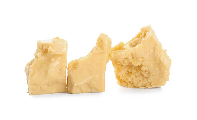 Pieces of cocoa butter on white background