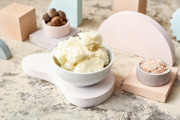 Composition with shea butter, nuts and sea salt on grunge background
