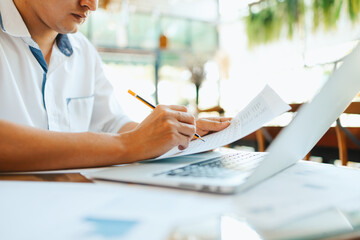 Administrator businessman making report, calculating balance. Business analyzing income charts,...