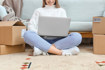 Young woman using laptop at home