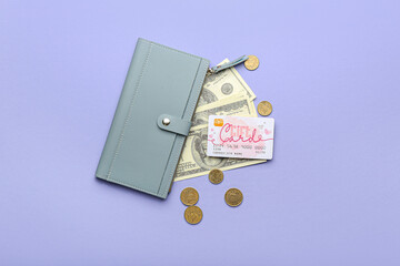 Wallet with gift card and money on color background