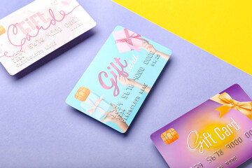 Gift cards on color background