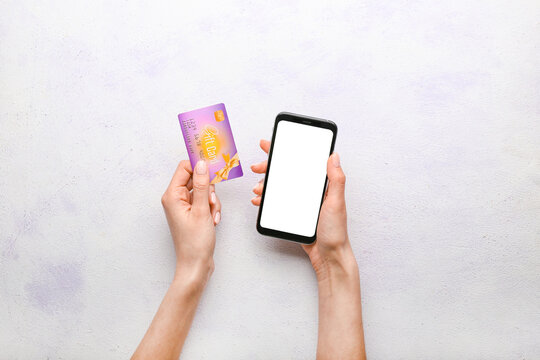 Woman With Gift Card And Mobile Phone On White Background