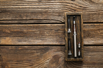 Electronic cigarette on wooden background
