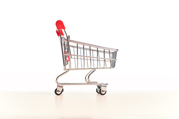 Empty shopping cart on a white background. Food shopping concept