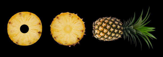 Pineapple set. Whole pineapple and slices isolated on black background. Picture of tropical fruit