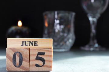 Day 5 of June month. Wooden calendar with date. Empty space for text.