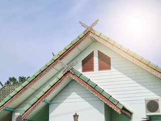 Large triangular gable roof with Thai pattern And green tiles