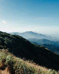 beautiful blue sky high peak mountains green forest guiding for backpacker camping backpacking hiking idea long weekend at Kew Mae Pan Nature Trail Waterfall Doi Inthanon, Chiang Mai, Thailand.