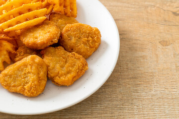fried chicken nuggets with fried potatoes