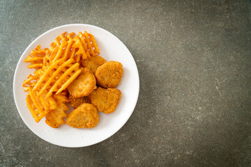 fried chicken nuggets with fried potatoes