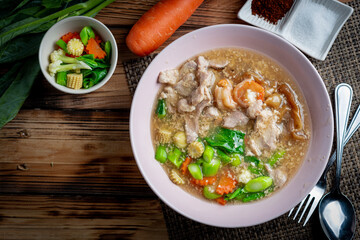 Fried noodle with pork in gravy sauce (Thai food called Rad Na Moo), Thai foods style.