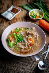 Fried noodle with pork in gravy sauce (Thai food called Rad Na Moo), Thai foods style.